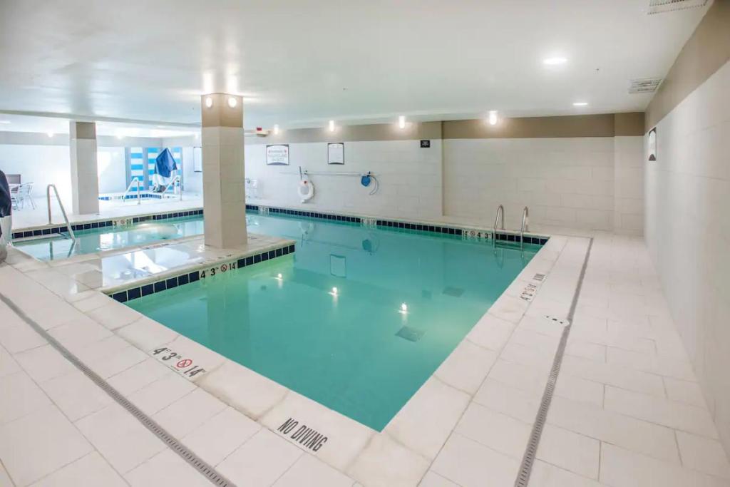 Staybridge Suites Denver Downtown by IHG large swimming pool with jacuzzi