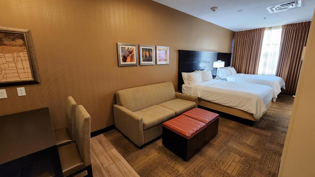 Staybridge Suites Denver Downtown by IHG bedroom with two beds