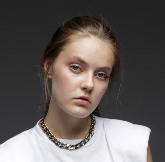 girl with jewelry in a white T-shirt